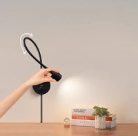 Schwarze flexible LED-Wandleuchte, verstellbar, modernes Design, ideal für Leseecken.