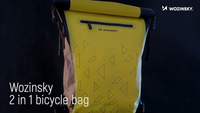 Gelbe wasserdichte Fahrradtasche mit Dreiecksmuster, Rollverschluss und Reißverschluss.
