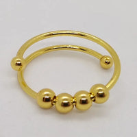 Goldener Nasenring mit Kugeln, Piercingschmuck, Edelstahl, modisch, glänzend, Unisex-Accessoire.