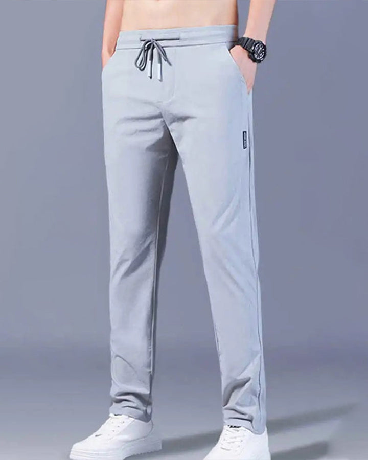 Graue Herren-Sporthose, atmungsaktiv, mit Kordelzug, ideal für Fitness und Freizeit.