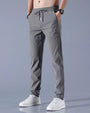 Graue Herren-Sporthose, elastisch, atmungsaktiv, mit Kordelzug, ideal für Fitness und Freizeit.