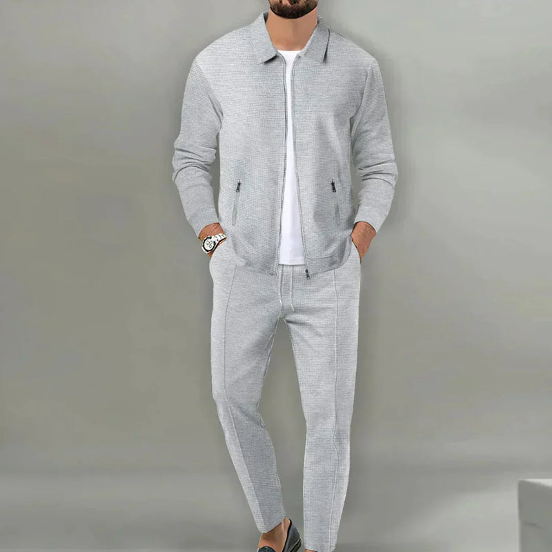 Grauer Herren-Trainingsanzug, Reißverschlussjacke, Jogginghose, Freizeitmode, Sportbekleidung.