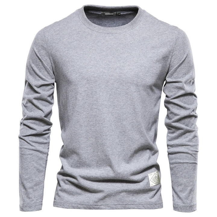 Graues Langarmshirt aus Baumwolle für Herren, klassisches Design, bequem und stilvoll.