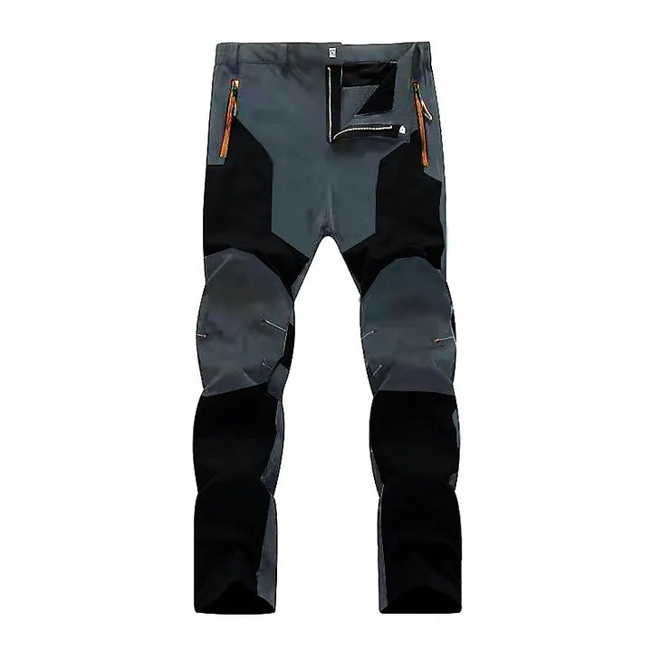 Graue Outdoor-Hose, wasserdicht, mit Reißverschlusstaschen, ideal für Wandern und Trekking.
