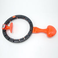 Hula-Hoop-Reifen mit Zählwerk, schwarz-orange, Fitnessgerät, abnehmbar, Kunststoff.