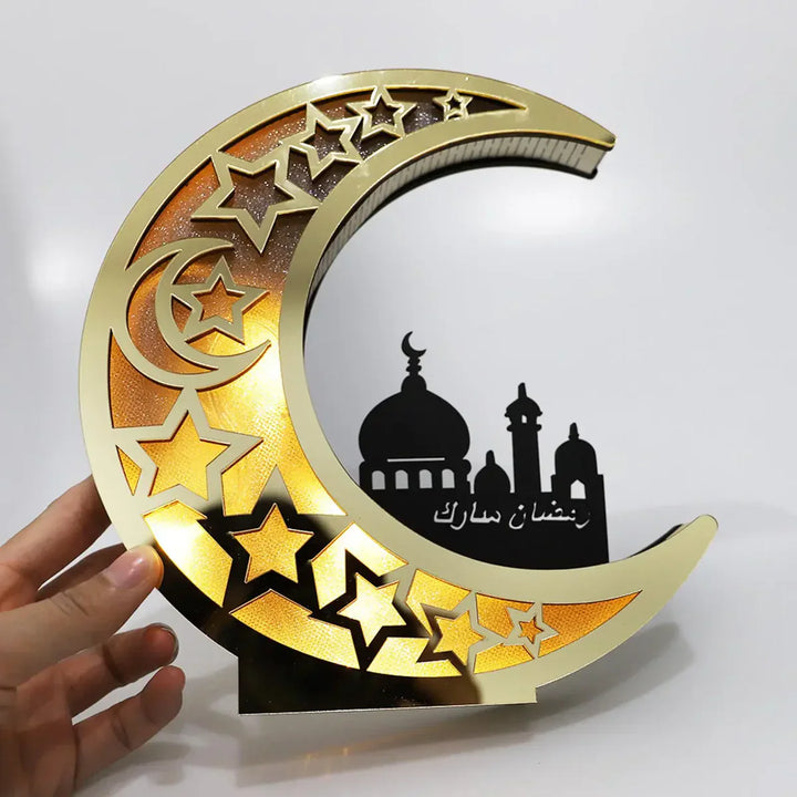 Goldene LED-Nachtlampe mit Mond- und Sternmotiv, ideal für festliche Dekorationen.