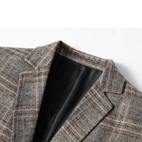 Graues kariertes Sakko aus Wolle, Herrenmode, elegantes Design, Nahaufnahme, klassischer Stil.