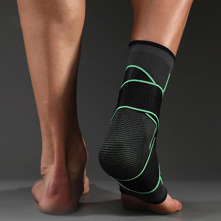 Schwarze Knöchelbandage mit grünen Akzenten, atmungsaktiv, für Sport und Unterstützung.