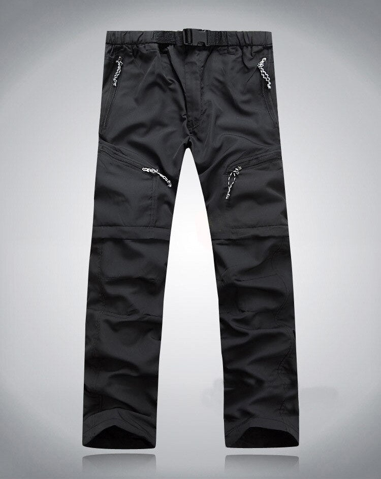 Schwarze Outdoor-Performance-Hose, wasserabweisend, mit Reißverschlusstaschen und verstellbarem Bund.