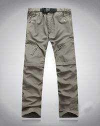 Beige Outdoor-Hose, elastisch, mit Reißverschlusstaschen, ideal für Wandern und Trekking.