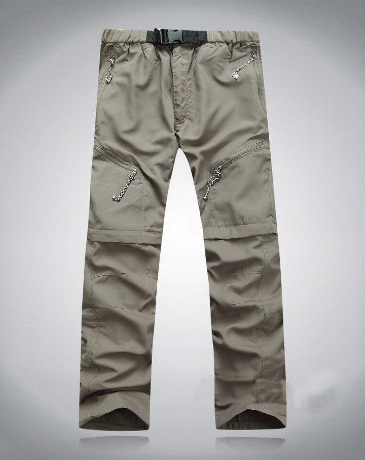 Beige Outdoor-Hose, elastisch, mit Reißverschlusstaschen, ideal für Wandern und Trekking.