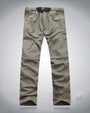 Beige Outdoor-Hose, elastisch, mit Reißverschlusstaschen, ideal für Wandern und Trekking.