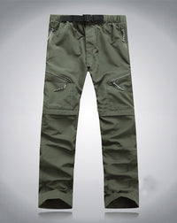 Grüne Outdoor-Hose, elastisch, mit Reißverschlusstaschen, ideal für Wandern und Trekking.