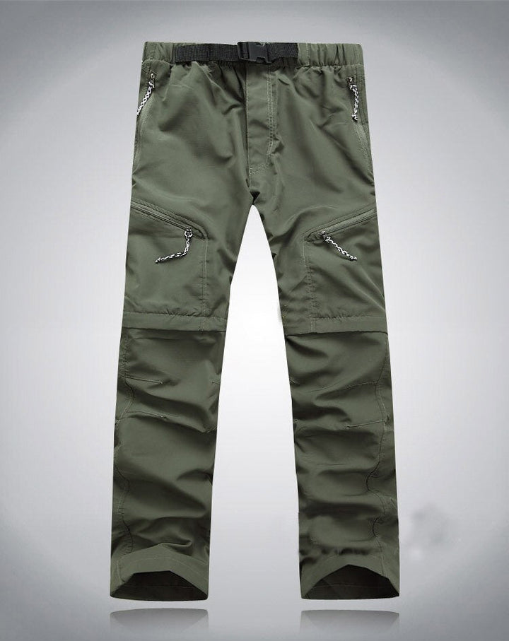 Grüne Outdoor-Hose, elastisch, mit Reißverschlusstaschen, ideal für Wandern und Trekking.