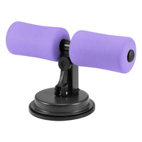 Lila Bauchtrainer mit Saugnapf, Fitnessgerät für Heimtraining, kompakt und tragbar.