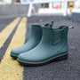 Grüne Gummistiefel für Damen, wasserdicht, rutschfest, ideal für Regenwetter.